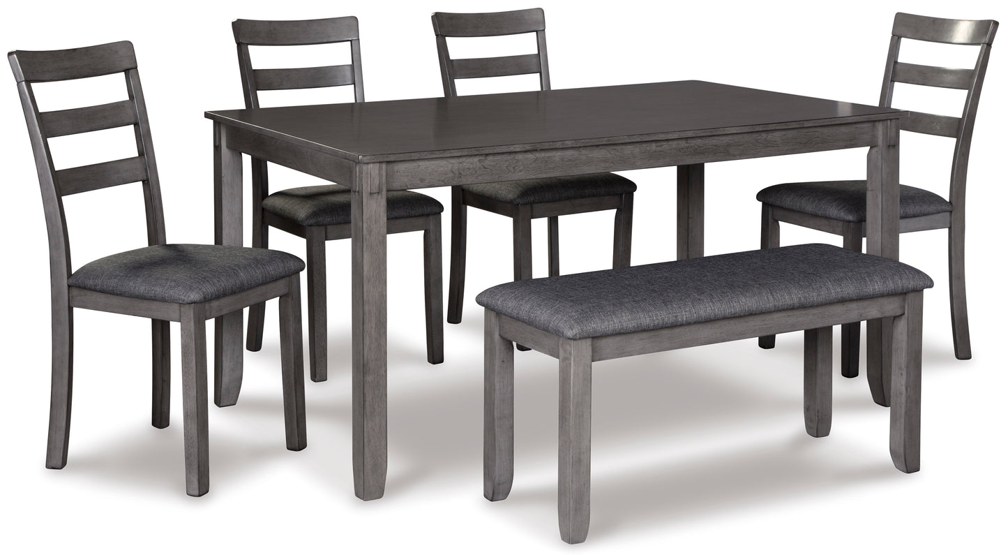 Bridson dining room table with four chairs and bench
